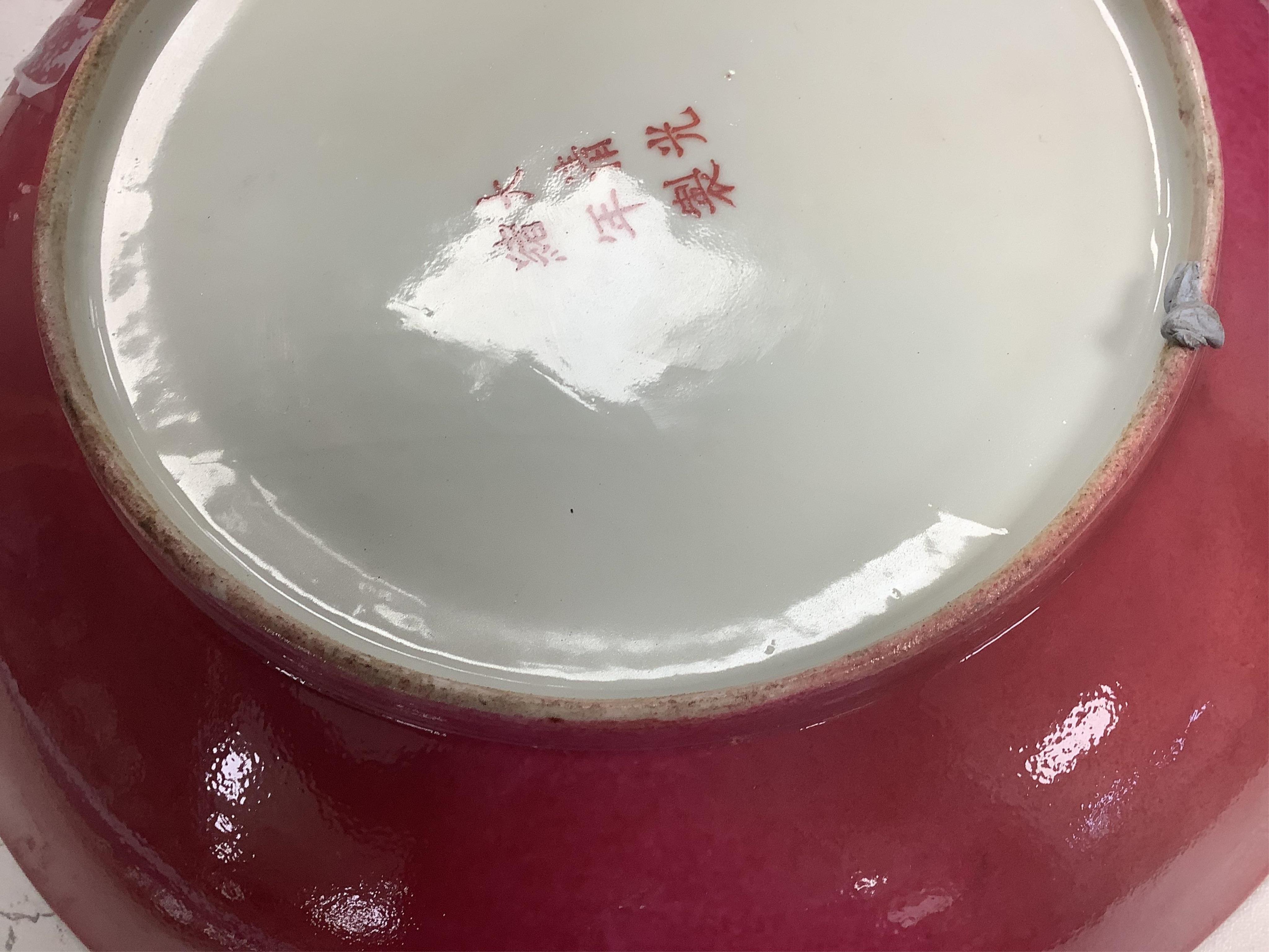 A Chinese enamelled porcelain millefleur dish, Guangxu mark and probably of the period, on wooden stand, diameter 28cm. Condition - restored